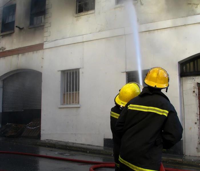 Firefighters putting out fire in an old building
